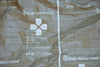 Open hypothermia blanket showing the MARCH diagram and the manufacturer name of Blue Force Gear.