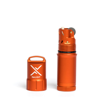 A rugged orange waterproof lighter made by Exotac, shown with its cap off, placed next to its cap.