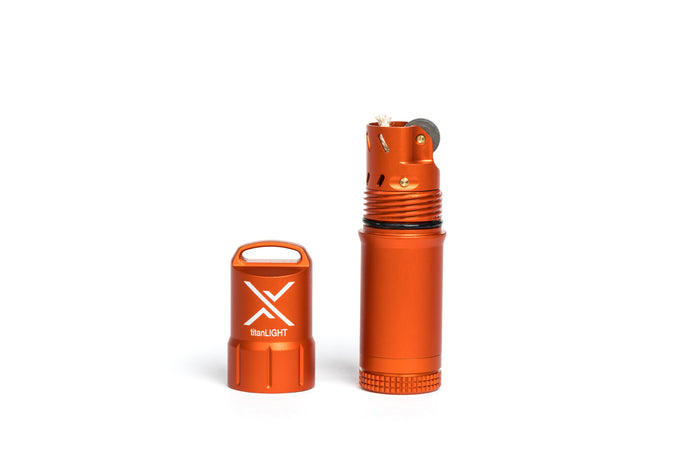A rugged orange waterproof lighter made by Exotac, shown with its cap off, placed next to its cap.